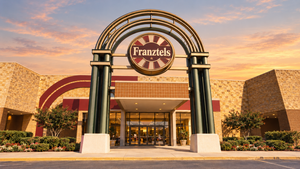 Franztels mall entrance beneath a warm early-evening sky