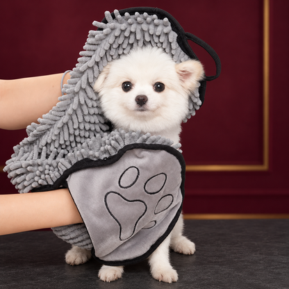 Grey pet drying towel with hand pockets used to dry a small white dog
